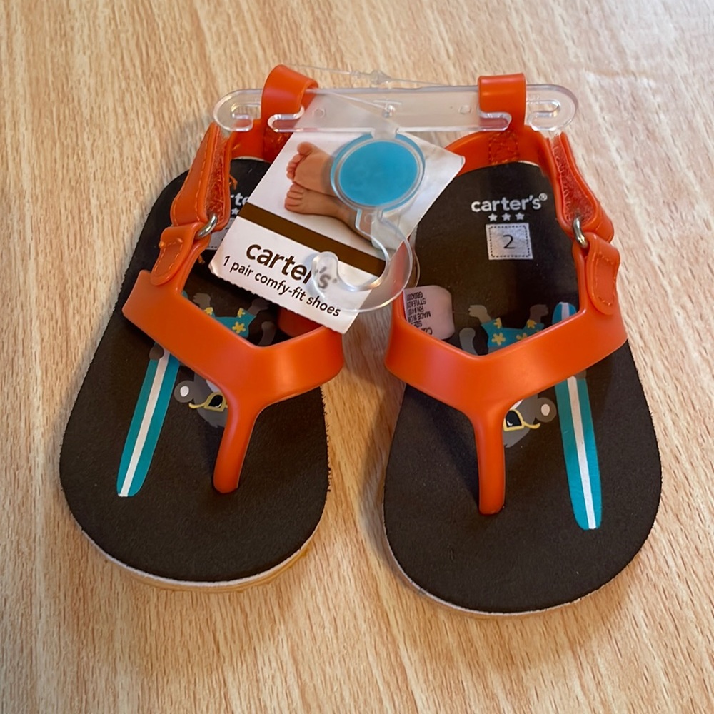 Carter’s size 2 infant/baby sandals/flip-flops black and orange with strap